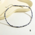Detail of blue marble beads necklace with silver spacers and metal lobster clasp closure - Cylindrical Tube Bead Necklace (NE2289-B) / Dark Blue
