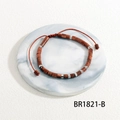 Detail of handmade semi-precious stone bead bracelet with adjustable woven red cord - Tan Goldstone Style (BR1821-B)