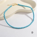 Detail of beaded necklace with light blue stones, gold spacers, and lobster clasp closure - Sky Blue (NE2290-D)
