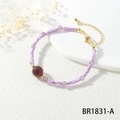 Macro shot of candy-colored beaded bracelet with purple square gems and golden lobster clasp - Purple Square Beads Red Main Bead (BR1831-A)