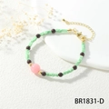 Detail of beaded bracelet with green square tiles and pink round bead on white display - Light Green Discs Pink Main Bead (BR1831-D)