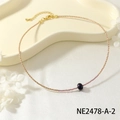 Dainty purple rice bead choker necklace with a dark pearl and gold spacers for women. - Pink Purple Beaded Choker with Single Dark Pearl (NE2478-A-2)