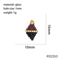 Macro detail of handmade two-tone diamond glass bead charm with 16mm x 10mm dimensions - Purple Gold Black Diamond Style (P02253)