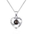 Silver-toned heart-shaped projection necklace with clear crystals on cross chain - Platinum 925 Sterling Silver