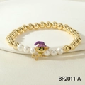 Halloween beaded bracelet with gold beads, pearls, and a cat witch charm on elastic cord - Gold Witch Cat Style (BR2011-A)