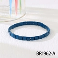 Detailed view of the dark blue TILA tile stretch bracelet on a white textured background - Sapphire Blue (BR1962-A)
