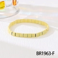Detail shot of pale yellow TILA bead bracelet with white speckles on a white background - Pale Yellow White Spotted (BR1963-F)