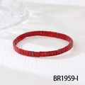 Detailed macro shot of red tile beads with marble patterns on a handmade elastic bracelet - Red Speckled (BR1959-I)