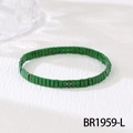 Close-up of bohemian green enamel beaded bracelet with ethnic pattern on white fabric - Grass Green Speckled (BR1959-L)