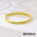 Close-up of a yellow stretch bracelet featuring flat rectangular beads with white polka dots - Yellow Polka Dot Patchwork (BR1959-R)