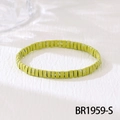 Detail of handmade green Tila bead bracelet with white speckled texture and glossy finish - Grass Green White Dotted (BR1959-S)