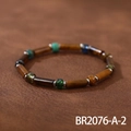 Detailed view of handmade beaded bracelet with tiger eye stones on brown leather - Tiger Eye Wood Texture Cylinder (BR2076-A-2)