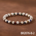 Detail shot of a handmade beaded bracelet with colorful natural stones on leather background - White Marble Cylinder Bead (BR2076-B-2)