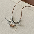 Retro handmade necklace with brown cord, silver star, and a wooden puppy horse pendant - Adjustable Leather Rope Rocking Horse