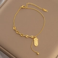 Fußkettchen aus 18K vergoldetem Titan mit Kaffeebohnenkette und Glücksanhänger - Goldenes Glückszeichen