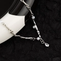 Zilveren titanium ketting met witte parels en druppelvormige zirkoon hanger - Waterdruppel Parelketting