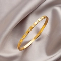 Elegant gold titanium steel bangle featuring eight inlaid zircons on a polished finish - Eight Round Zirconia Style (sztx077)