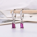 Close-up of S925 sterling silver hallmark on rectangular purple zircon drop earrings - Platinum Plated Rose Red Zirconia