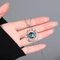 Detail of silver crescent moon and blue planet pendant necklace with sparkling zircons - Small Planet Silver - Cable Chain