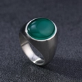 Macro shot of an oval green opal gemstone set in a wide polished stainless steel ring band - US 6 / Silver Green Cat's Eye