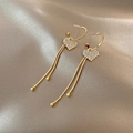 Elegant gold heart tassel earrings with sparkling crystals on champagne silk background - Gold Rhinestone Heart Tassel (A291)