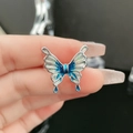 Detailed macro of a silver butterfly ring with blue gradient enamel and glitter finish - Blue-White Gradient Glitter (6#-C)