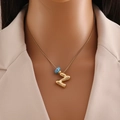 Détail du collier en or 18k avec œil protecteur et pendentif lettre Z de style ballon - Lettre Z Or