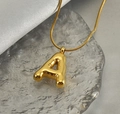 Detail shot of golden balloon-style letter A pendant on a sleek snake chain necklace - Letter A / 45cm Snake Chain / Gold