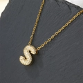 Gold plated letter S pendant necklace with shimmering zircon stones on a black stone base - Letter S (Pendant Only)