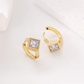 Macro detail of 18k gold earrings with square stones and fine vertical textures - Gold / White Rhinestone