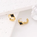 Macro detail of 18k gold plated stainless steel square earrings with black inlay - Gold / Black