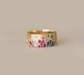 Close-up of matte gold ring featuring colorful zircon stones and brushed texture - Gold / US 6