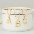 Elegant gold letter pendant necklaces with A, B, and C charms on delicate box chains - Letter A / Gold
