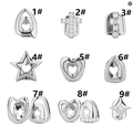 Macro view of silver hip hop grillz featuring heart, cross, and star motifs with zircons - Hollow Heart Style (Style 1#) / Silver