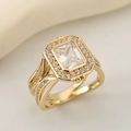Macro shot of gold square emerald-cut ring with halo accents and split shank detail - US 6 / Gold