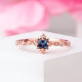 Vintage 18K rose gold ring with a round blue gemstone and delicate floral diamond settings - US 6 / Rose Gold