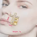 Detailweergave van gouden kruis tandsieraad met zirkonia van 9mm bij 7mm - Kruis tandjuweel / 9x7mm (Enkel) / Goud