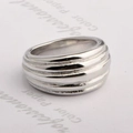 Polished silver wide metal ring featuring a minimalist ribbed tiered texture design - US 7 / Steel