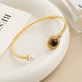 Bracciale a treccia oro vintage francese con pietra occhio di tigre marrone e perle bianche - Bracciale in Occhio di Tigre