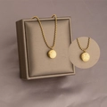 Golden titanium steel necklace with a double-sided round pendant featuring Fu and Xi characters - Lucky Double Sided Ball Necklace