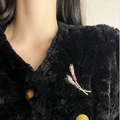 Wheat ear brooch in gold finish with pink zircon crystals on a black faux fur coat - Wheat Ear Style