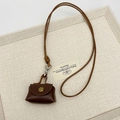 Brown leather mini pouch necklace pendant with vintage gold snap button and woven lanyard - Brown