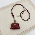 Mini burgundy leather earphone pouch with gold metal clasp and long neck strap - Red
