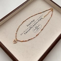 Kleurrijke kralenketting met een gouden vlinderhanger en verstelbare verlengketting - Kleurrijke Kristallen Vlinder Ketting