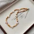 Boho strandketting met kralen en zeesterren en kleurverloop voor een zomerse uitstraling - Natuurlijke Zeester Kralenketting