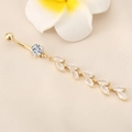 Golden belly ring featuring zircon leaf tassel and marquise crystals on a curved bar - Gold