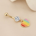 Macro detail of golden navel ring with round zircon and rainbow enamel heart pendant - Enamel Rainbow Heart Gold