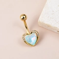 Detailed view of golden heart-shaped belly ring with aurora center stone and zircon accents - Aurora Zirconia Heart Gold
