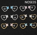 Macro shot of gold and silver heart-shaped nose rings with sparkling floral zircon inlays - Open Type 1# / Silver with Blue Zirconia