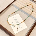 Handgemaakte kralenketting met turkoois en parelmoer, elegant vintage ontwerp - Parel Kralen Kwastje Ketting